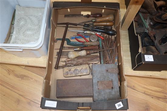 A collection of carpentry and bookbinding tools